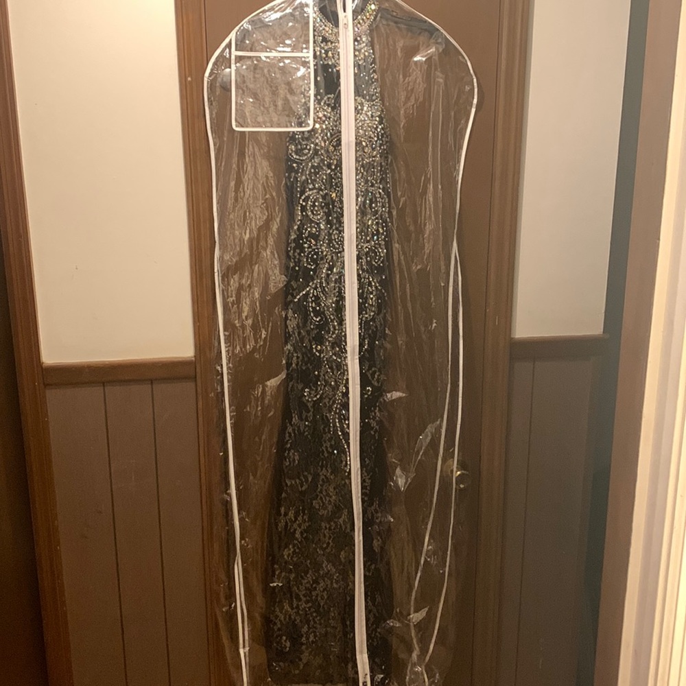 Black dress with silver beading. Size 4 never worn.
